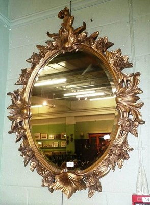 Lot 598 - Ornate gilt framed oval mirror