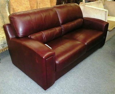 Lot 613 - Burgundy leather settee