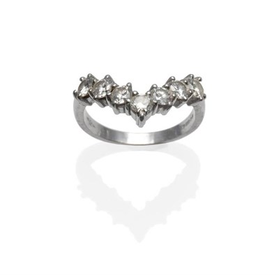 Lot 319 - An 18 Carat White Gold Diamond Wishbone Ring, the seven round brilliant cut diamonds in white...