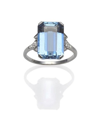 Lot 320 - An Aquamarine and Diamond Ring, the emerald-cut aquamarine in a white four claw setting, to...