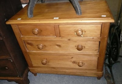 Lot 671 - A pine three height chest of drawers