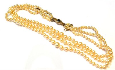 Lot 324 - A Cultured Pearl Necklace, three rows of graduated cultured pearls knotted to an Art Deco style...