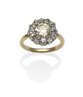 Lot 329 - A Diamond Cluster Ring, circa 1900, a fancy yellow old cut diamond within a border of white old cut