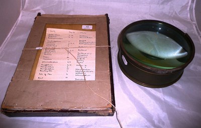 Lot 15 - A large magnifier with a leather wallet of contour road maps