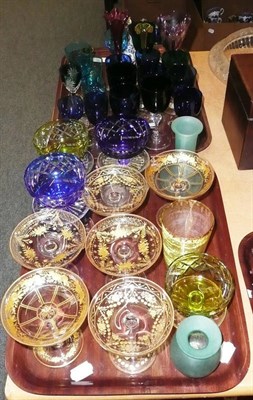 Lot 25 - Two trays of assorted coloured wine glasses, cut glass sundae dishes etc