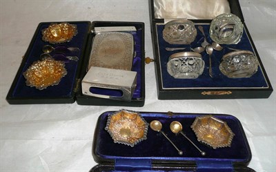 Lot 29 - Two cased sets of embossed silver salts and spoons, cased set of four cut glass salts with...