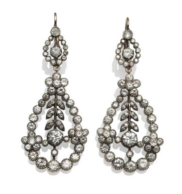 Lot 335 - A Pair of Diamond Earrings, comprising a large pear shaped drop in floral and foliate form,...