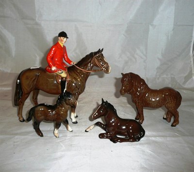 Lot 42 - Beswick seated huntsman on bay hunter and three ponies (4)