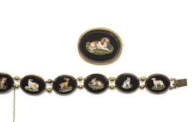 Lot 336 - A Micro-Mosaic Brooch, depicting a dog (possibly a King Charles spaniel) within an oval onyx,...