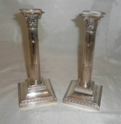 Lot 52 - Pair of loaded silver candlesticks