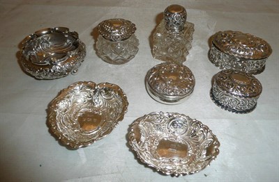 Lot 97 - Assorted small silver embossed pin trays, hinged boxes and silver mounted glass jars (8)