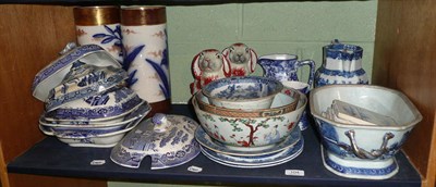 Lot 104 - Shelf including willow pattern tureens and covers, Delft tiles, pair of reproduction pottery...