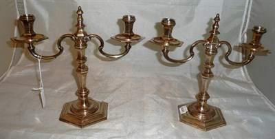 Lot 117 - A pair of silver two branch candelabra