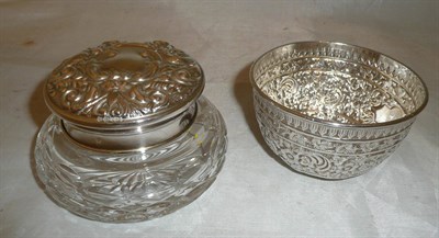 Lot 118 - A Victorian silver embossed circular bowl and cut glass jar with embossed silver lid stamped...