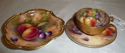 Lot 124 - A Royal Worcester fruit painted cup and saucer by Austin and a small Royal Worcester shaped dish by