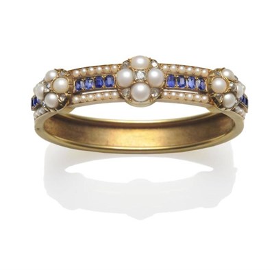 Lot 344 - A Victorian Gem Set Bangle, three clusters of split pearl and old cut and rose cut diamonds...
