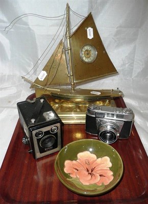 Lot 131 - A Moorcroft bowl, a brass clock as a yacht and two cameras