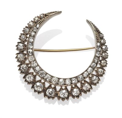 Lot 345 - A Diamond Crescent Brooch, circa 1880, an inner row of old cut diamonds in channel settings,...