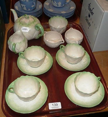 Lot 139 - A four piece Belleek tea service and a pair of Belleek twin handled bowls
