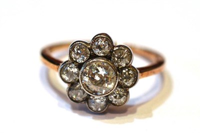 Lot 350 - A Diamond Cluster Ring, an old cut diamond within a border of eight smaller, in white...