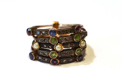 Lot 351 - A Gemstone Ring, five rings linked together, set with rose cut diamonds, sapphires, garnets, pearls