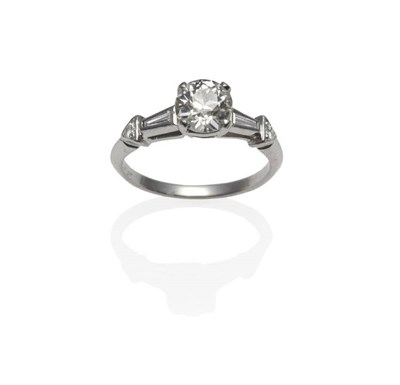 Lot 353 - A Diamond Solitaire Ring, an old cut diamond in a white four claw setting, a tapered baguette...