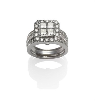 Lot 355 - A Diamond Cluster Ring, four princess cut diamonds within a border of round brilliant cut diamonds