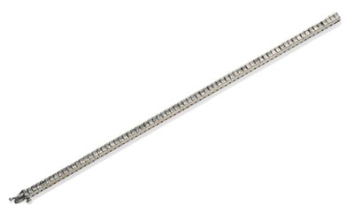 Lot 356 - A Diamond Line Bracelet, set with princess cut diamonds in articulated white channel settings,...