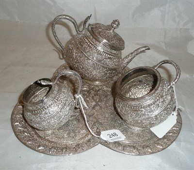 Lot 248 - An Indian white metal three piece tea set and tray