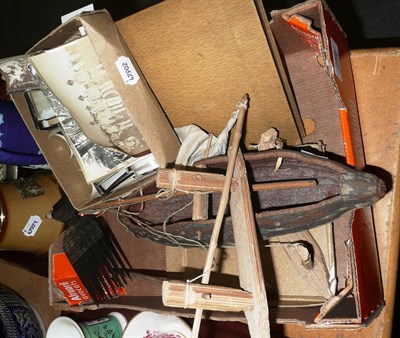 Lot 256 - An African comb, a Native model of a sailing boat, a photograph album and a quantity of photographs