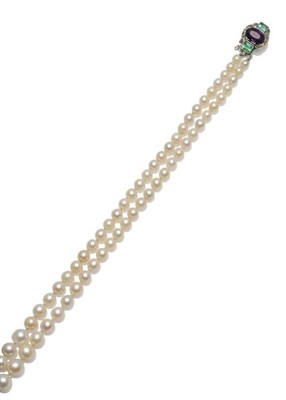 Lot 357 - A Two Row Cultured Pearl Necklace, the graduated cultured pearls knotted to an Arts & Crafts catch