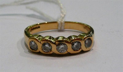 Lot 279 - An 18ct gold diamond five stone ring