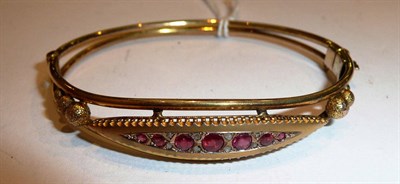 Lot 295 - A ruby and diamond bangle