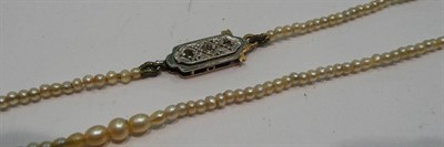 Lot 302 - A seed pearl necklace with diamond set snap