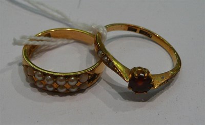 Lot 303 - Two seed pearl set rings (a.f.)