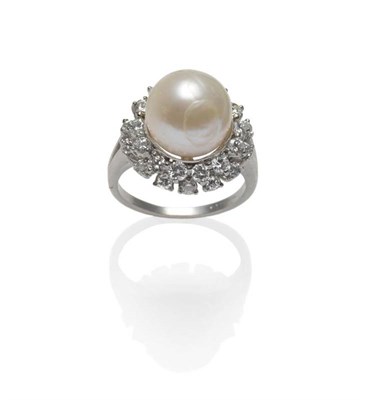 Lot 364 - A Pearl and Diamond Cluster Ring, the central cultured pearl within a double border of round...