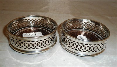 Lot 331 - Pair of small pierced wine coasters