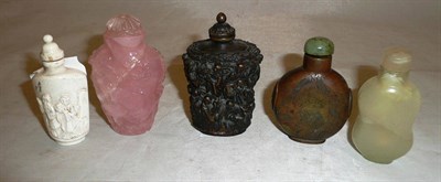 Lot 336 - Five Chinese snuff bottles, including a rose quartz relief carved example worked with a sage...