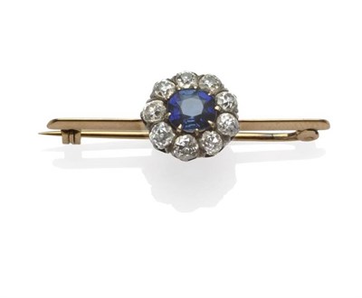 Lot 367 - A Sapphire and Diamond Bar Brooch, a cluster comprising a cushion shaped mixed cut sapphire...