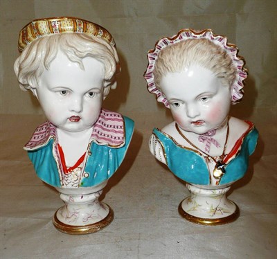 Lot 372 - A pair of 19th century pottery pedestal child busts