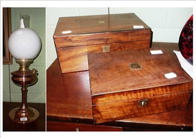 Lot 390 - Two mahogany hinged writing slopes and a copper oil lamp with opaque glass shade (3)