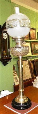 Lot 396 - Tall brass column oil lamp with etched glass shade and chimney