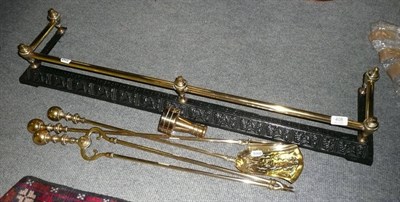 Lot 408 - Brass and steel fender, three brass fire irons and brass weight