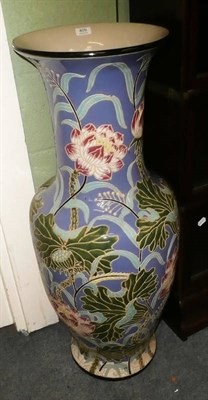 Lot 409 - A large Earthenware baluster vase with floral decoration