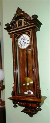 Lot 485 - A Vienna type double weight driven wall clock with two weights and pendulum