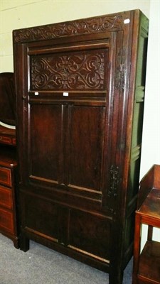 Lot 496 - A 19th century oak cupboard with carved panel (alterations)