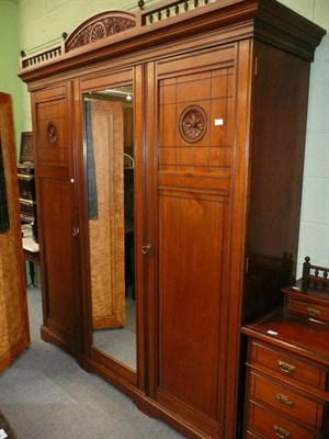 Lot 501 - An Edwardian mahogany three piece bedroom suite in the aesthetic style comprising: triple wardrobe