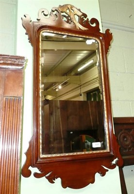 Lot 504 - Georgian mahogany fret cut mirror with a carved bird surmount