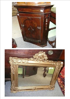 Lot 506 - Dark oak carved corner cupboard and a gilt framed wall mirror (2)