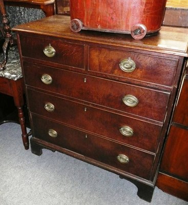 Lot 510 - George II oak straight front chest of two short and three long drawers